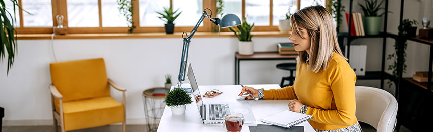 Woman uses MS Office at her desk