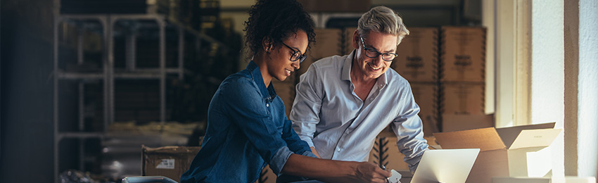 Small business owners organizing store inventory