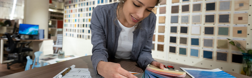 Interior decorator reviewing colour swatches in an office