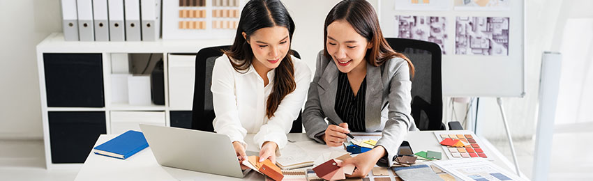 Interior decorator reviewing colour swatches in an office