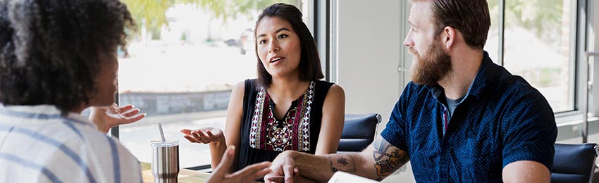 A mediation professional talking with an adult couple