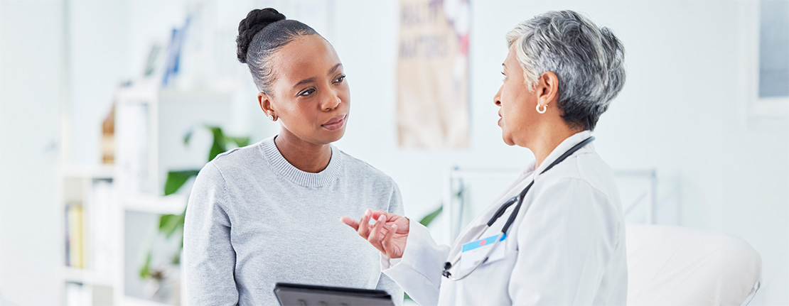 A medical professional explaining a procedure to a patient.