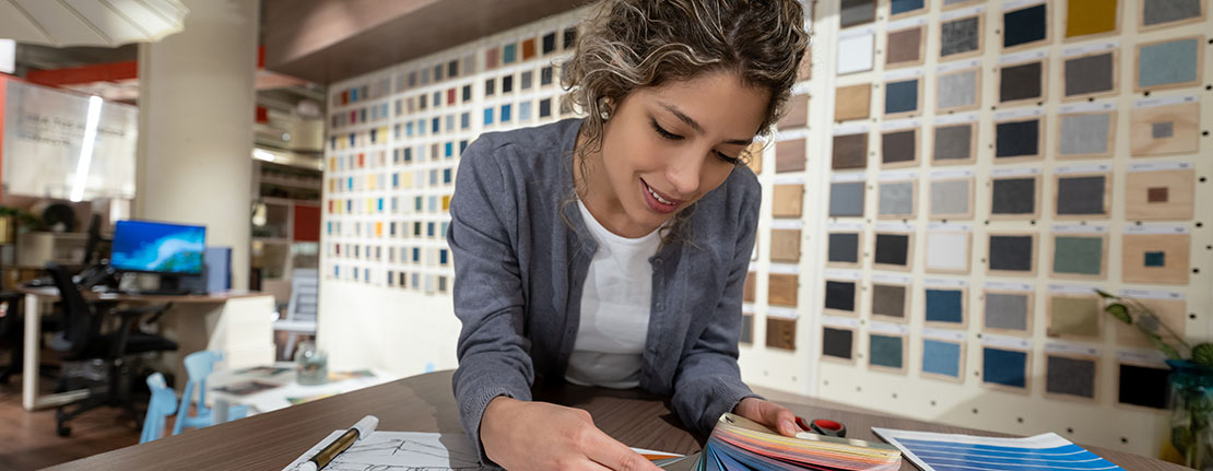 Interior decorator reviewing colour swatches in an office