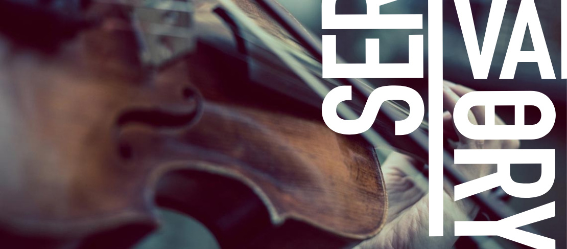  A violin, bow and hand placed in position on the neck of the instrument